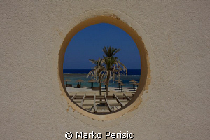 Port hole to the sea by Marko Perisic 
